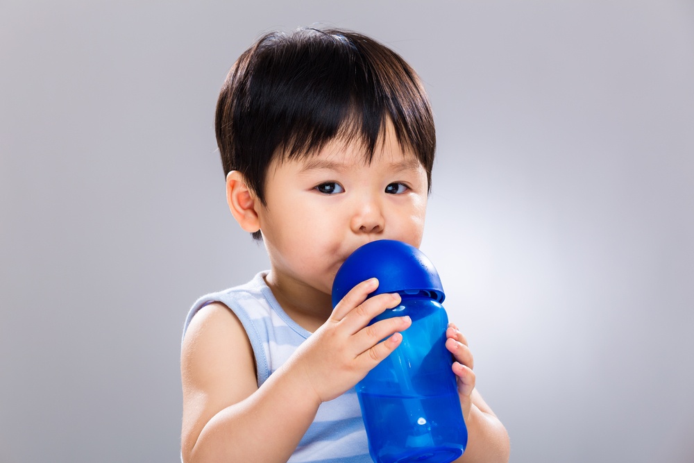 Asian baby drinking water