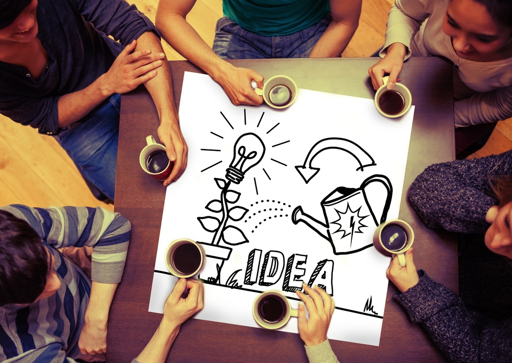 Composite image of idea and innovation graphic on page with people sitting around table drinking coffee-1